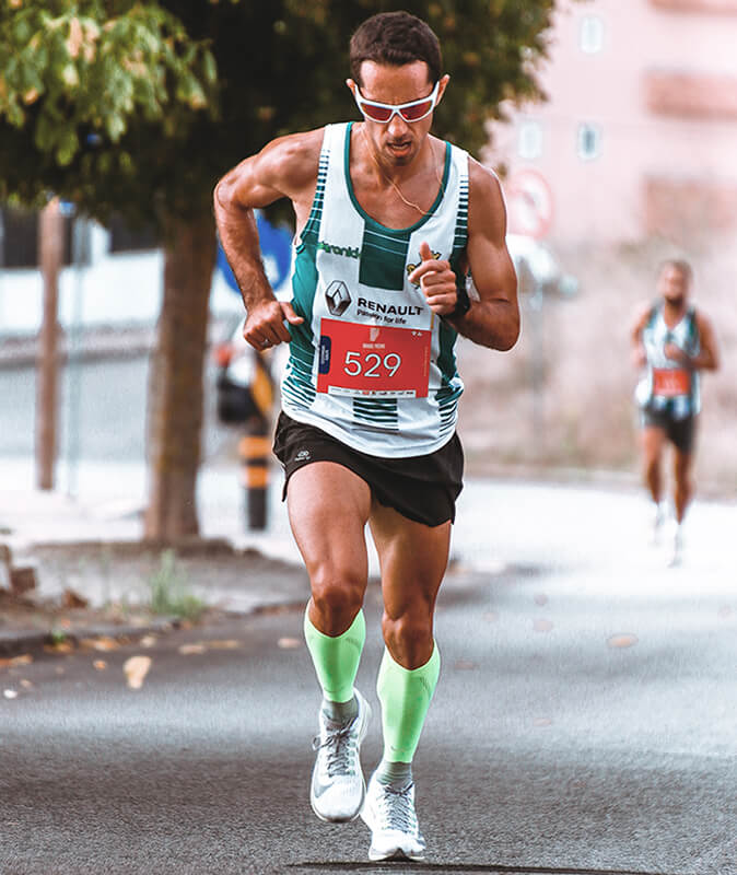 Marathon race running men wearing compression socks